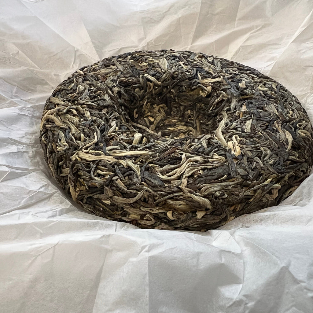 Annual Grace 2026 raw pu-erh tea cake side and thickness