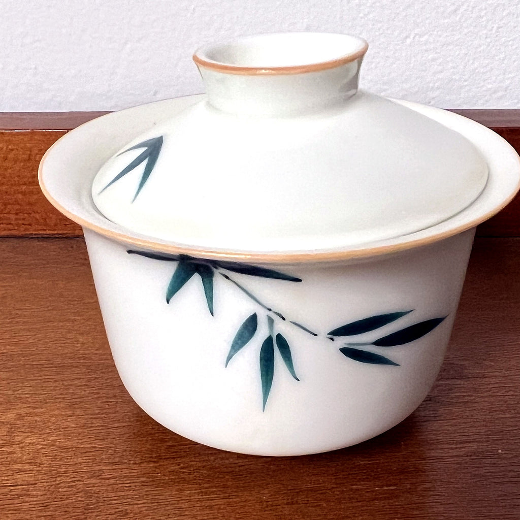 Close front view of bamboo gaiwan porcelain bowl and lid