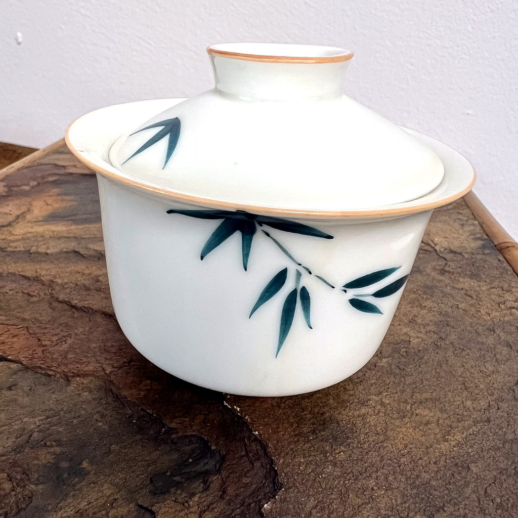 Bamboo gaiwan on stone surface for tea brewing