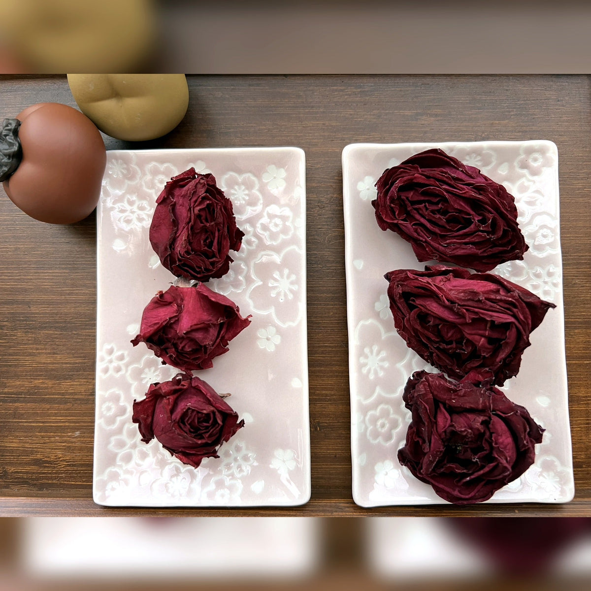 Freeze-dried Ink Red Roses loose buds detail on porcelain plates